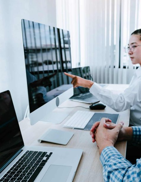 work partners looking at a computer screen