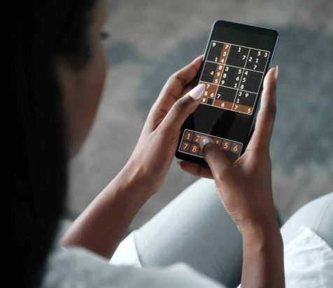 Woman playing a game on a smart phone